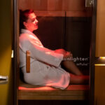 The infrared sauna at Nearing Total Health with a person relaxing inside