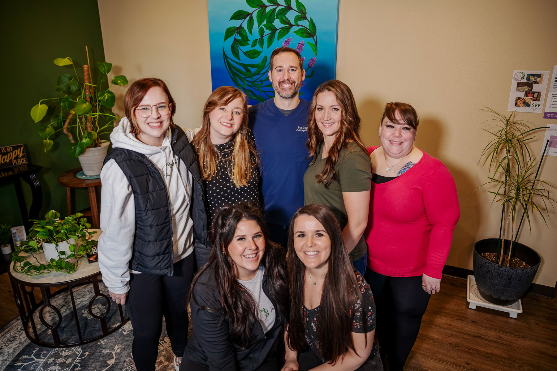 The team at Nearing Total Health, posing in the lobby