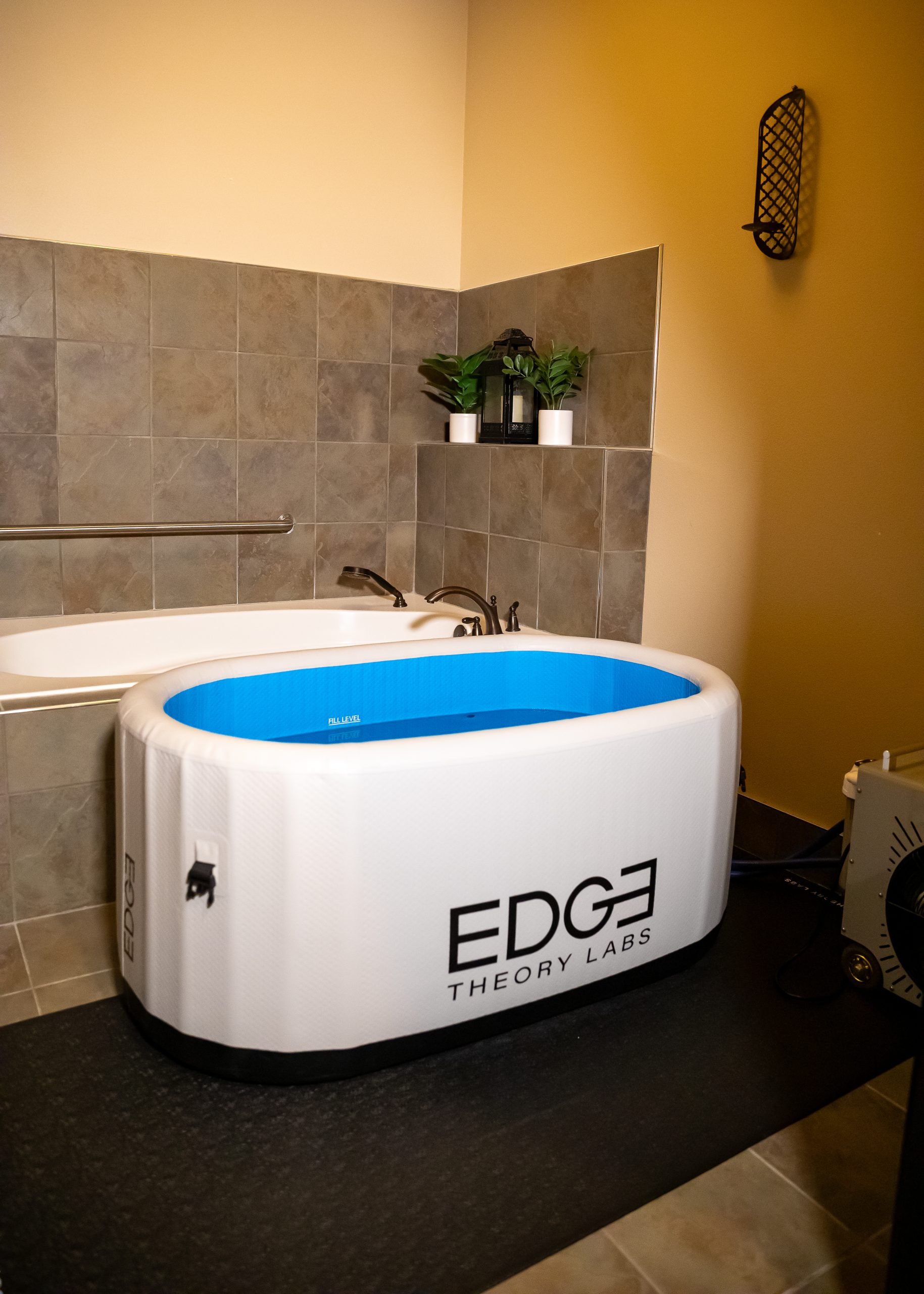 A woman lying in the Cold Plunge tub